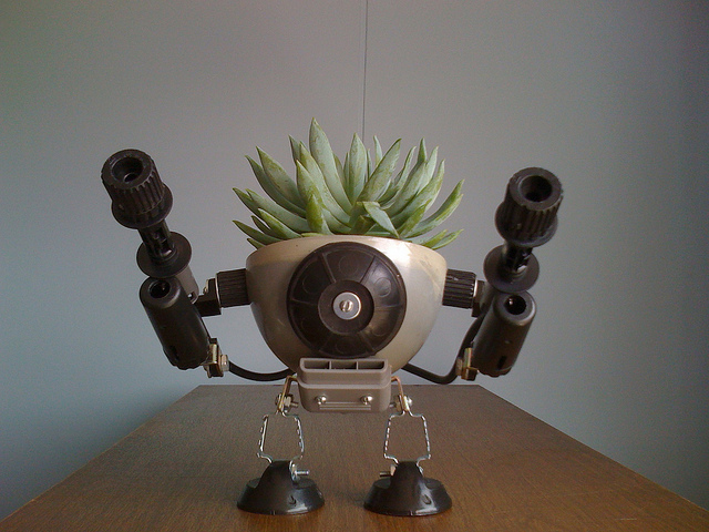 recycled robo planter people